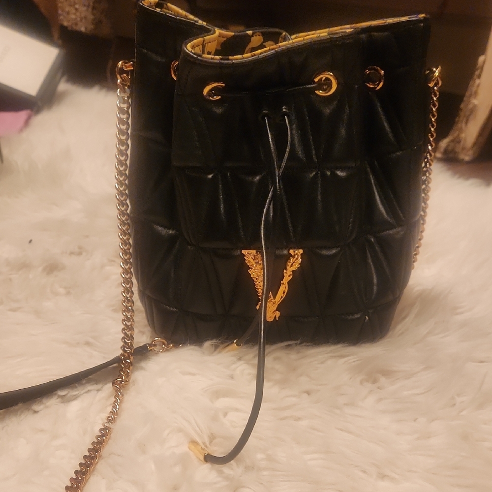 Versace Black and Gold Backpack with Elegant Monogram